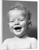 1940s Portrait Baby With Messy Hair Laughing With Eyes Closed by Anonymous