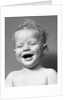 1940s Portrait Baby With Messy Hair Laughing With Eyes Closed by Anonymous