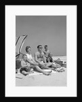 1960s Family Portrait Mother Father Daughter And Two Sons Sitting On Beach Under Umbrella by Anonymous