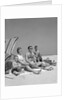 1960s Family Portrait Mother Father Daughter And Two Sons Sitting On Beach Under Umbrella by Anonymous