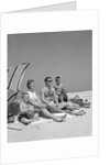 1960s Family Portrait Mother Father Daughter And Two Sons Sitting On Beach Under Umbrella by Anonymous