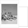 1960s Family Portrait Mother Father Daughter And Two Sons Sitting On Beach Under Umbrella by Anonymous