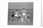 1960s Back View Of Family Of 5 Holding Hands Running Into Ocean by Anonymous