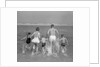 1960s Back View Of Family Of 5 Holding Hands Running Into Ocean by Anonymous