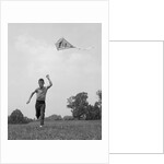 1960s Boy Running Flying Kite by Anonymous