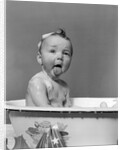 1940s Wet Baby In Bath Covered With Soap Suds Sticking Out Tongue by Anonymous