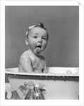 1940s Wet Baby In Bath Covered With Soap Suds Sticking Out Tongue by Anonymous