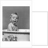 1940s Wet Baby In Bath Covered With Soap Suds Sticking Out Tongue by Anonymous