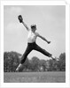 1960s Boy Jumping In Outfield To Catch Baseball With Gove by Anonymous