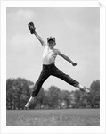 1960s Boy Jumping In Outfield To Catch Baseball With Gove by Anonymous