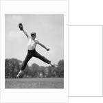 1960s Boy Jumping In Outfield To Catch Baseball With Gove by Anonymous