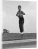 1960s Boy Jumping On Pogo Stick by Anonymous