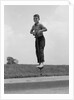 1960s Boy Jumping On Pogo Stick by Anonymous