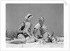 1970s 1960s Family Father Mother Twin Sons Playing In Sand On Beach Outdoor by Anonymous