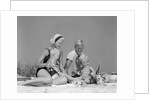 1970s 1960s Family Father Mother Twin Sons Playing In Sand On Beach Outdoor by Anonymous