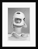1960s Baby In Diaper Seated Holding Astronaut Helmet With Antennae On Head by Anonymous