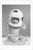 1960s Baby In Diaper Seated Holding Astronaut Helmet With Antennae On Head by Anonymous
