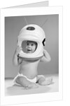 1960s Baby In Diaper Seated Holding Astronaut Helmet With Antennae On Head by Anonymous