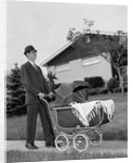 1960s Man Pushing Stroller Baby Carriage Suburban Sidewalk by Anonymous