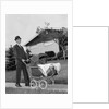 1960s Man Pushing Stroller Baby Carriage Suburban Sidewalk by Anonymous