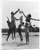 1960s Family Jumping Playing Beach Volleyball by Anonymous