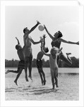 1960s Family Jumping Playing Beach Volleyball by Anonymous