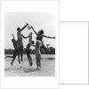 1960s Family Jumping Playing Beach Volleyball by Anonymous