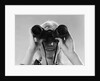 1960s Woman Looking Through Binoculars by Anonymous