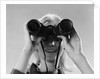 1960s Woman Looking Through Binoculars by Anonymous