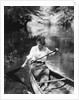 1920s Woman With Upswept Hair Paddling Wooden Canoe In Stream by Anonymous