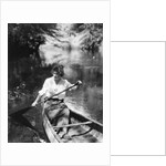 1920s Woman With Upswept Hair Paddling Wooden Canoe In Stream by Anonymous