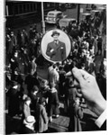 1930s 1940s Pedestrian Street Crowd Magnifying Glass Focused On Single Well Dressed Man by Anonymous
