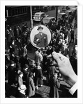 1930s 1940s Pedestrian Street Crowd Magnifying Glass Focused On Single Well Dressed Man by Anonymous
