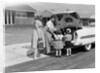 1950s Family Packing Trunk Of Car For A Picnic by Anonymous