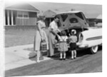1950s Family Packing Trunk Of Car For A Picnic by Anonymous