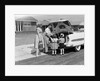1950s Family Packing Trunk Of Car For A Picnic by Anonymous