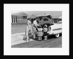 1950s Family Packing Trunk Of Car For A Picnic by Anonymous