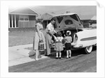 1950s Family Packing Trunk Of Car For A Picnic by Anonymous
