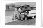 1950s Family Packing Trunk Of Car For A Picnic by Anonymous