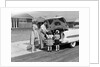 1950s Family Packing Trunk Of Car For A Picnic by Anonymous