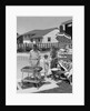1950s Family In Backyard Beside Pool Having Cookout Of Hot Dogs and Hamburgers by Anonymous