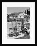 1950s Family In Backyard Beside Pool Having Cookout Of Hot Dogs and Hamburgers by Anonymous