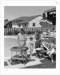 1950s Family In Backyard Beside Pool Having Cookout Of Hot Dogs and Hamburgers by Anonymous