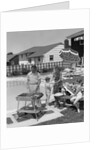 1950s Family In Backyard Beside Pool Having Cookout Of Hot Dogs and Hamburgers by Anonymous