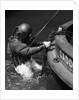 1930s Side View Of Diver In Pressure Suit Descending Into Water From Side Of Boat by Anonymous