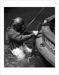 1930s Side View Of Diver In Pressure Suit Descending Into Water From Side Of Boat by Anonymous