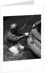 1930s Side View Of Diver In Pressure Suit Descending Into Water From Side Of Boat by Anonymous