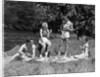 1930s Two Couples Having Summer Picnic With Food And Drink Spread Out On Blanket The Tip Of A Canoe Is Visible by Anonymous
