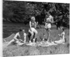 1930s Two Couples Having Summer Picnic With Food And Drink Spread Out On Blanket The Tip Of A Canoe Is Visible by Anonymous