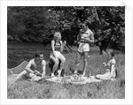 1930s Two Couples Having Summer Picnic With Food And Drink Spread Out On Blanket The Tip Of A Canoe Is Visible by Anonymous